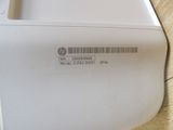 a close up of a white computer on a wooden table