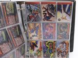 a binder with a lot of comic cards in it