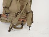 a backpack that is sitting on a white surface