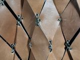 a close up of a piece of leather with a chain link around it