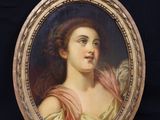 portrait of a woman in a pink dress in a gold frame