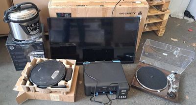 a lot of electronics that are sitting on the floor