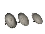 three silver metal knobs on a white surface with a white background