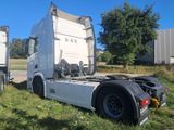 a semi truck that is parked on the side of the road