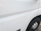 a white truck parked on the side of the road