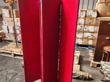 a red room divider in the middle of a warehouse