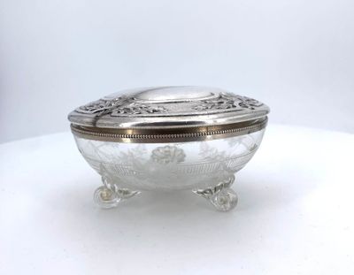 an image of a silver plate with a lid on a white table