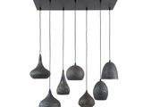 a group of five pendant lights hanging from a ceiling