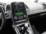 the interior of a car with a steering wheel, dashboard, and dashboard controls