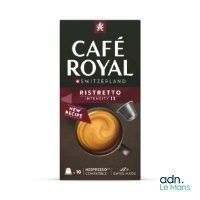 une boîte de café « Café Royal » accompagnée d'une tasse de café