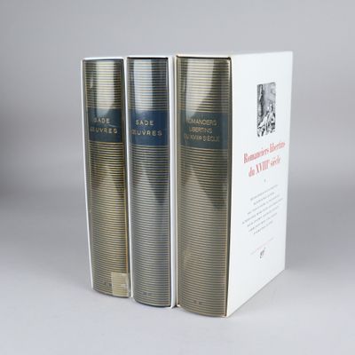 two books in a white box on a gray surface