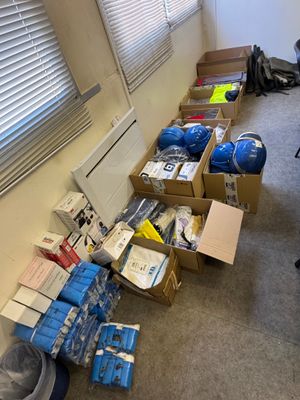 a room with boxes and boxes of items on the floor