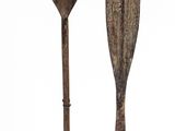 two paddles that are sitting on top of each other