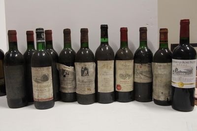 several bottles of wine are lined up in a row on a table