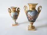 two vases that are sitting next to each other on a table