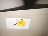 a picture of a white refrigerator with a yellow sticker on it