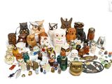 many different kinds of figurines on a white surface