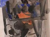 un tableau représentant un homme assis à une table avec un chien