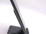 a cell phone that is sitting on top of a stand