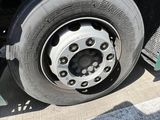 a flat tire on the side of a truck