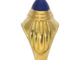 a close up of a gold object with a blue stone in it