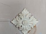 a white door with a decorative knob on it