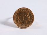 a close up of a coin ring with a woman ' s face on it