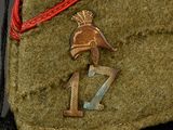 a close up of a military uniform with a badge on it