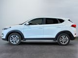 the white suv is parked in a room with a gray floor