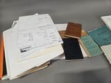 a lot of papers that are sitting on a table