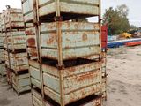 many crates stacked on top of each other in the dirt