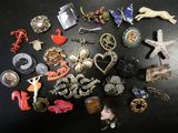 many different types of brooches on a table