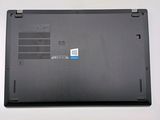 the back of a laptop with a blue sticker on it