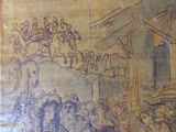 a drawing of a group of people on a wall