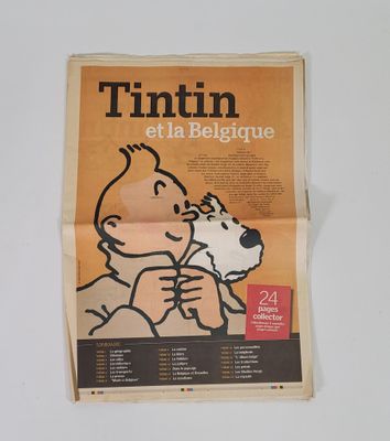 journal dont la une montre la photo d'un enfant et d'un chien
