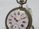 a silver pocket watch with roman numerals on it