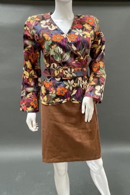 an image of a mannequin dressed in a floral print jacket and skirt