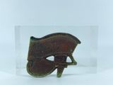 an image of a small metal object on a clear surface