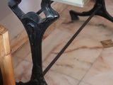 a small table with a red top on a marble floor