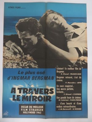 a movie poster for a movie starring a man and a woman laying on the beach
