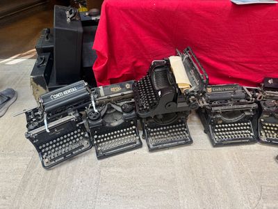 a lot of typewriters that are on the floor
