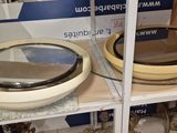 two bowls that are on a shelf in a store