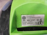 a close up of a green motorcycle with a sticker on it