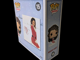 a box with a picture of a woman in a red dress on it
