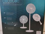 a box of three white fans sitting on top of a table