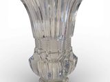 a glass vase that is sitting on a white surface