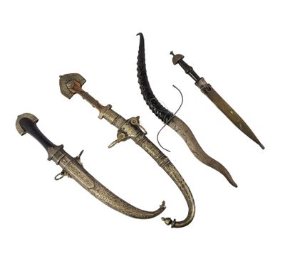 three different types of weapons are displayed on a white surface