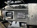 a close up of an electric motor on the ground
