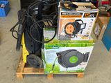 a pile of assorted items on a pallet in a garage