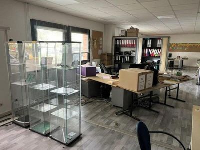 a glass display case in the middle of a room
